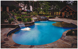 Custom pools built by CCH Pools, a custom pool builder, in Longview, Tx with stone work and water features