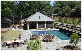Custom Pool house built by CCH Pools in Longview Texas, stone courtyard with a four column pool house