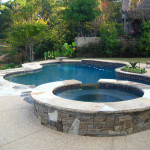 circular shaped pool with spa