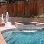 half circle spa overflow channel into pool