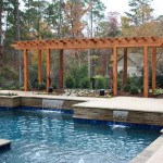 squared edge pool with flat water spouts and pergola