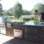stainless steel outdoor kitchen with black granite counter top